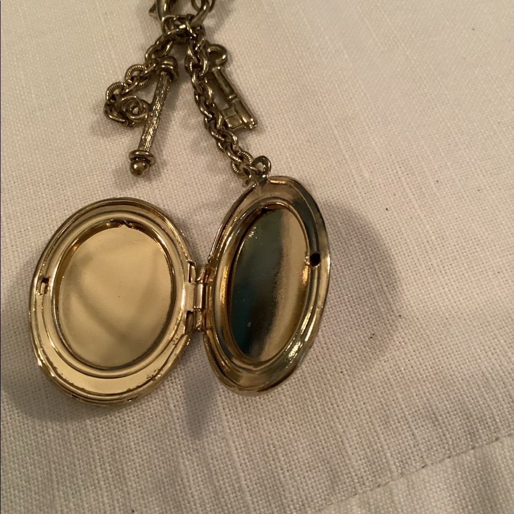 Vintage 1928 gold toned locket on long chain